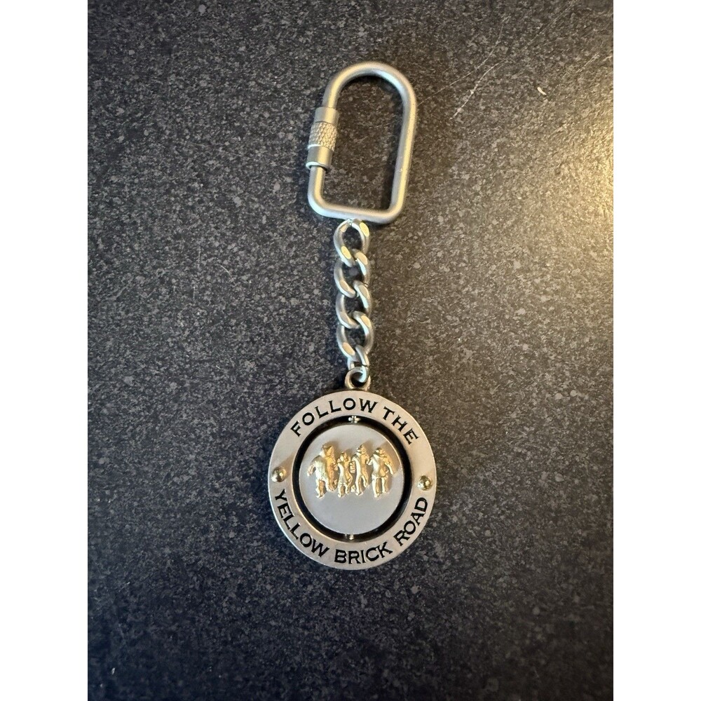 NWOT Wizard of Oz Keychain Metal Follow The Yellow Brick Road & Toto Spins